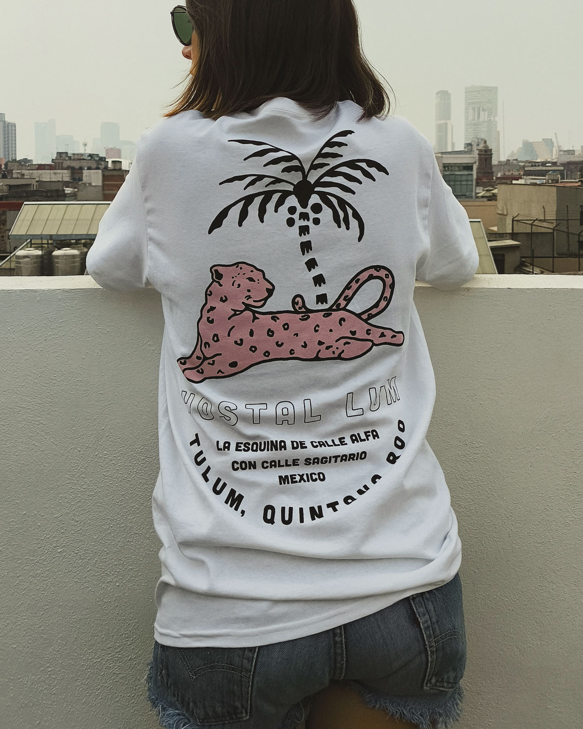 Hostal Lum T-shirt with pink jaguar and palm illustration