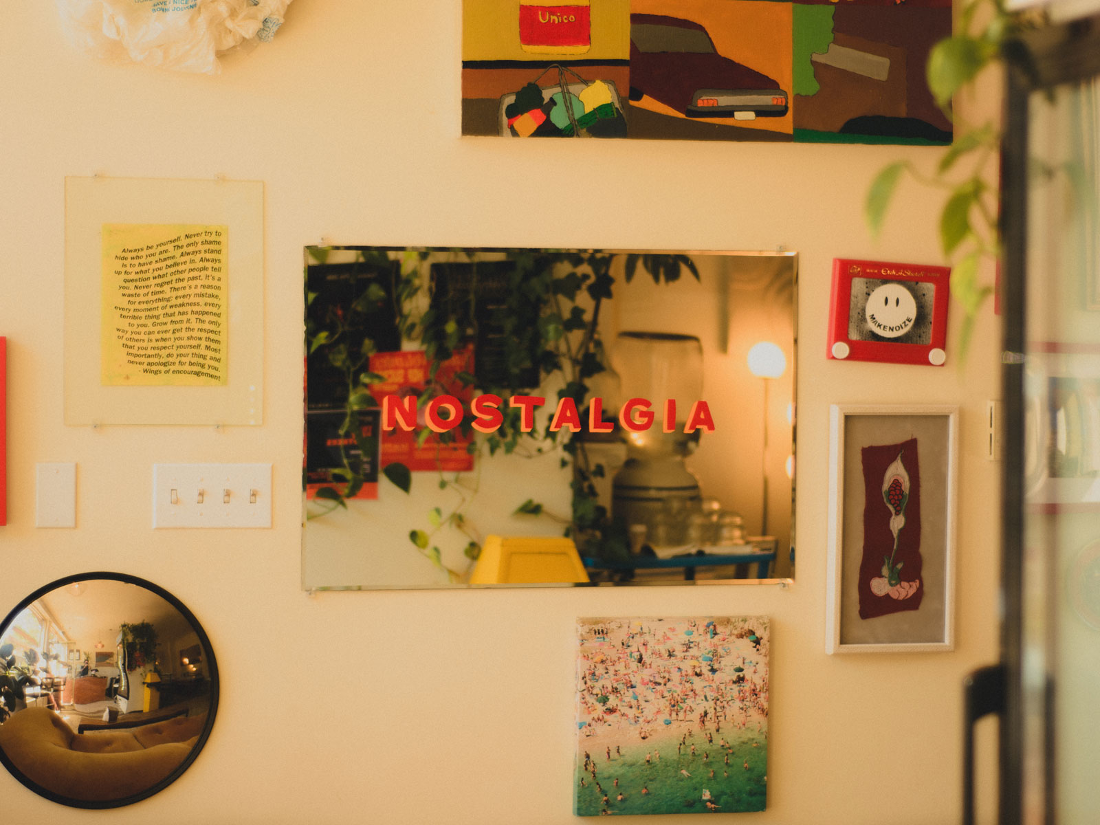 Nostalgia logotype painted on a mirrored wall